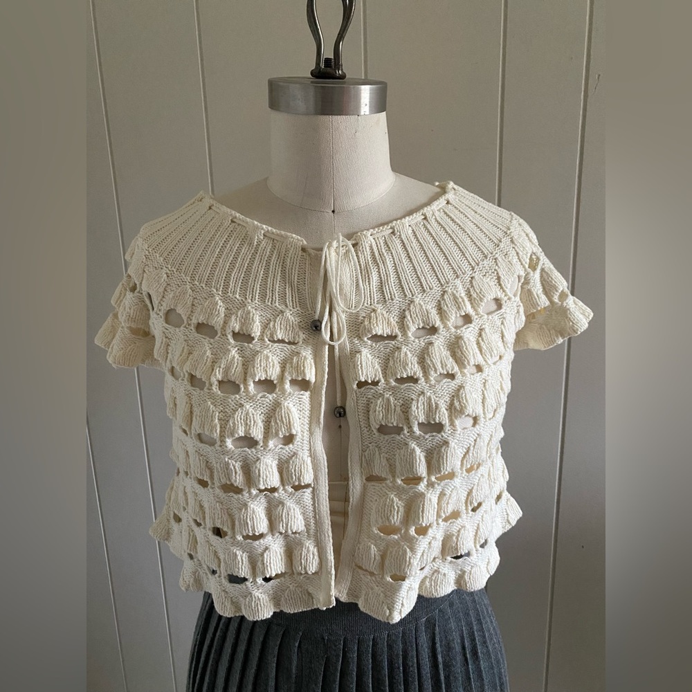 The most beautifully knitted cardigan with beaded tie detail